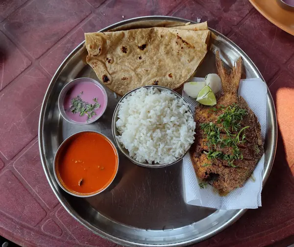 A Malvani fish thali with rice, bhakri and sol kadhi